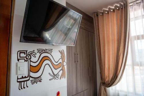 TV a/nebo společenská místnost v ubytování Casa Antade Cusco