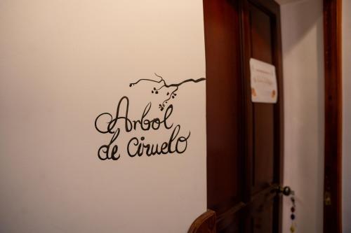 a wall with a sign that reads blood be crucified at Casa Antade Cusco in Cusco