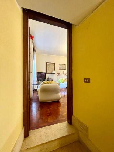 a view of a living room with a yellow wall at B&B Souvenirs d'Antan in Orvinio