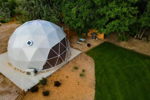 an overhead view of a domed building with a green field at 2 domes in Glendale Utah Fantastic Stargazing in Glendale