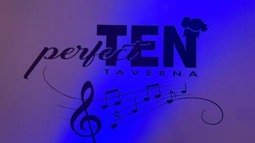 a sign with music notes on a purple background at Family Studios in Marathias