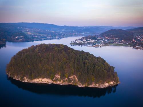 an island in the middle of a large body of water at Wzgórze Słońca in Gródek Nad Dunajcem