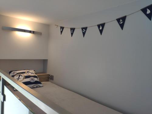a bedroom with a bunk bed with a banner at Wzgórze Słońca in Gródek Nad Dunajcem