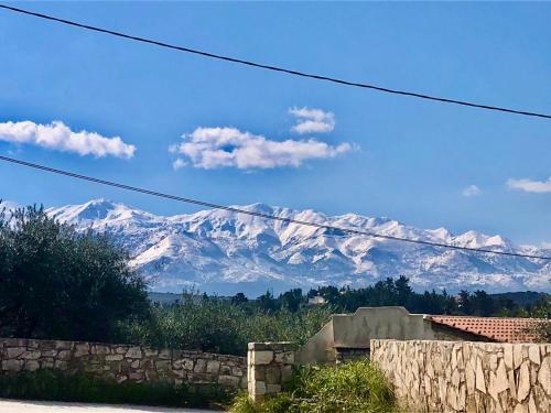 a view of a snow covered mountain in the distance at Villa Elpida Aspro in Koprána