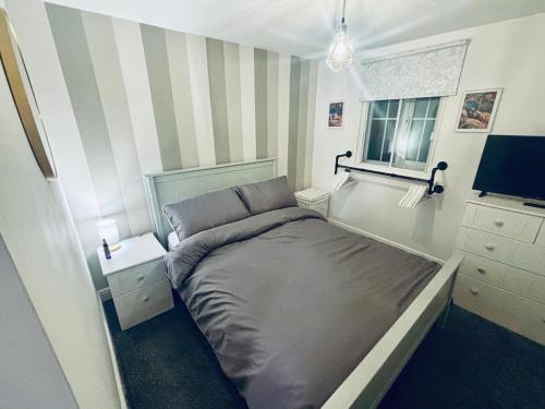 Ένα ή περισσότερα κρεβάτια σε δωμάτιο στο 1 bed apartment next to train station