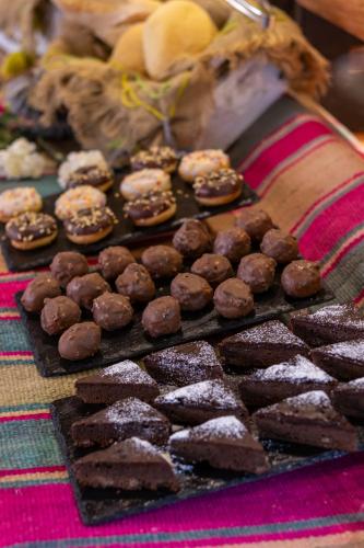 a bunch of chocolate and donuts on a table at Hotel Don Raul in San Pedro de Atacama