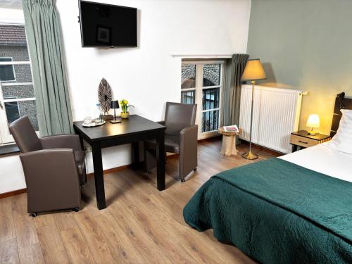 Postel nebo postele na pokoji v ubytování B&B en Vakantiewoningen 't Wienhoes
