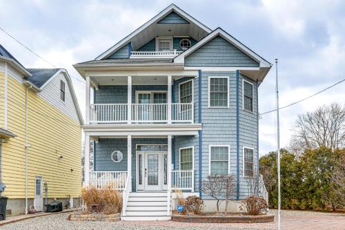 a blue house with a yellow house at 1 Mi to Jenkinsons Boardwalk Family Gem with Grill in Point Pleasant Beach