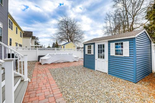 a blue shed is sitting on a brick patio at 1 Mi to Jenkinsons Boardwalk Family Gem with Grill in Point Pleasant Beach