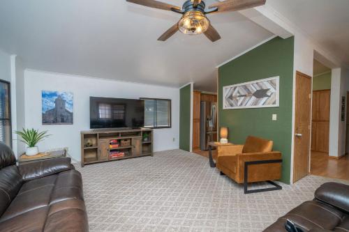 a living room with a couch and a ceiling fan at Buckskin Tango, Views! in Parker