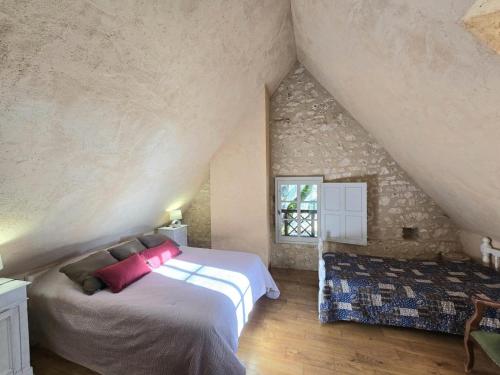 a bedroom with a large bed and a window at Charme Authentique en Périgord - Wifi, Parking, Animaux Acceptés - FR-1-616-103 in Monsac