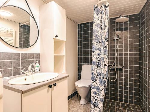 a bathroom with a sink and a toilet and a mirror at 4 person holiday home in Marstal-By Traum in Marstal