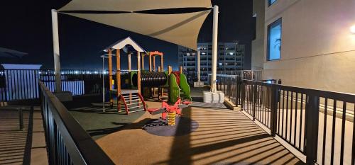 a playground on the balcony of a building at Unique studio E16 in Ras al Khaimah