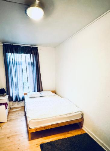 a bedroom with a bed and a window at RELAXED LIVING No 02 Historic Oslo in Oslo