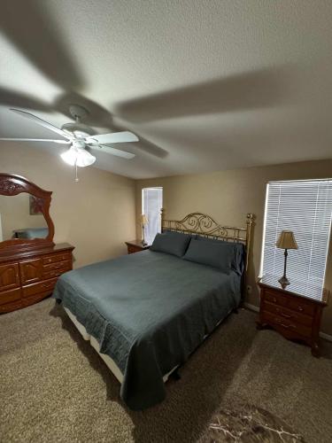 a bedroom with a bed and a ceiling fan at Cliff Hanger, River access with dock in Parker