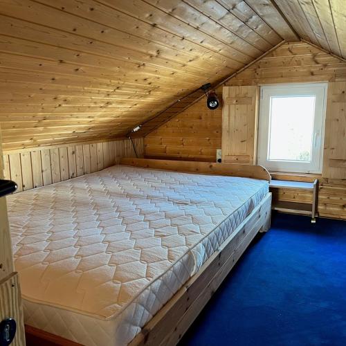Ένα ή περισσότερα κρεβάτια σε δωμάτιο στο Ferienhaus "Lütt Hüs"
