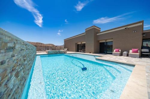 a swimming pool in the middle of a house at Eagles Lair, Poolside Luxury! in Parker