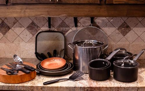 a group of pots and pans on a kitchen counter at Kastle on the Keys, private dock in Parker