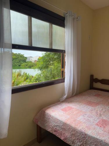 Postel nebo postele na pokoji v ubytování Uma casa aconchegante