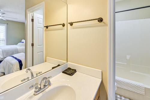 a bathroom with a sink and a mirror at Family Home with Ping-Pong and Fire Pit in Lexington in Lexington