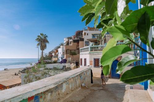 a view of the beach and buildings at Appartement Taghazout in Taghazout