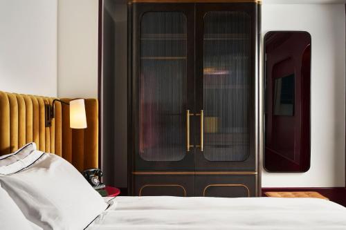a bedroom with a bed and a train door at Fidelity Hotel in Cleveland