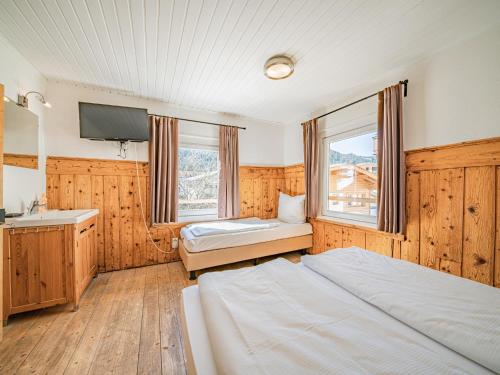 Posteľ alebo postele v izbe v ubytovaní Chalet Kirchberg L