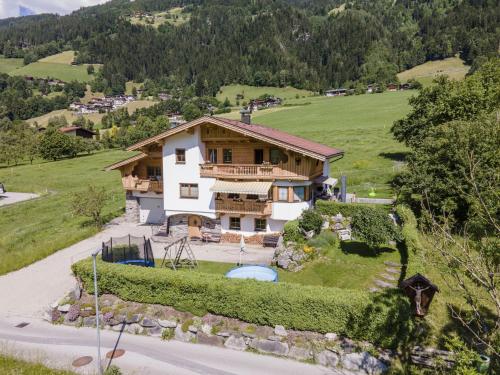 an aerial view of a house on a hill at Exclusive apartment with garden and whirlpool in Ramsau