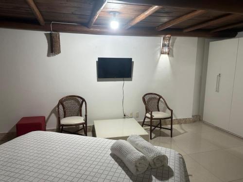Televisyen dan/atau pusat hiburan di apartamento luxo vila da praia do forte com mezanino