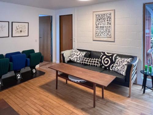 a living room with a couch and a table at 6 person holiday home in Asperup in Asperup