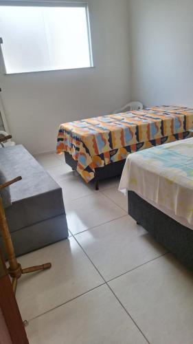Katil atau katil-katil dalam bilik di AP BAIRRO de FÁTIMA Familiar