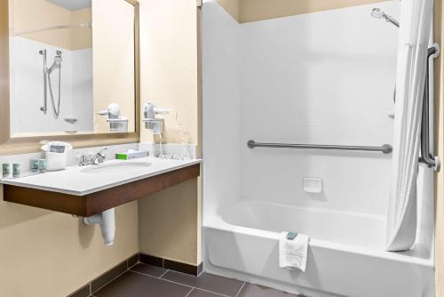 a bathroom with a sink and a shower at Best Western St. Louis Airport North Hotel & Suites in Hazelwood