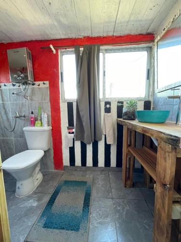 a bathroom with a toilet and a sink at Eyo Habitación privada en Chuy con baño Privado No es hostal in Chuy