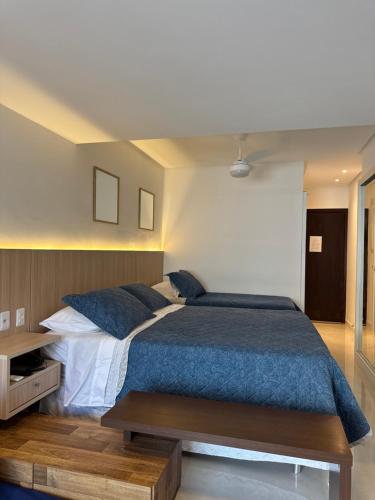 Postel nebo postele na pokoji v ubytování Bahia Flat 125 Apto Aconchegante