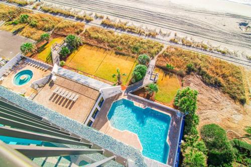 an overhead view of a swimming pool and a beach at Pet Friendly Modern Oceanfront Suite in Myrtle Beach