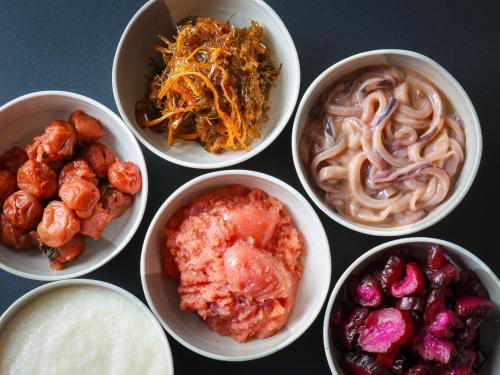 a group of bowls of food with different foods at APA Hotel Hakodate Ekimae in Hakodate