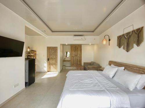 Ein Bett oder Betten in einem Zimmer der Unterkunft Green Coco House