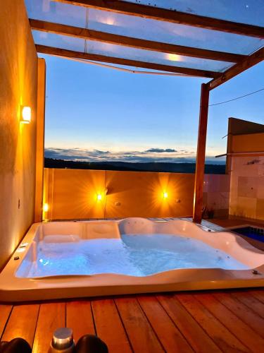a jacuzzi tub on the deck of a house at Casa Diamantina in Ibicoara