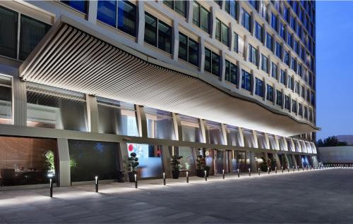 a large building with a lot of windows on it at JOYA Shanghai Gubei in Shanghai