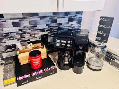 a coffee maker sitting on top of a counter at Winter Retreat 3b 3ba Huge backyard Mins from Downtown in Houston