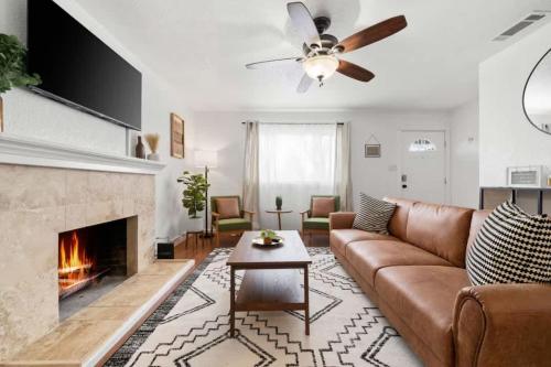 a living room with a couch and a fireplace at 3BR 2BA Gem in Rancho Near Shop Centers & Eateries in Rancho Cordova