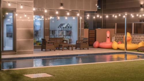 a house with a swimming pool with inflatable furniture at Pause Kids Pool Viila in Yeosu