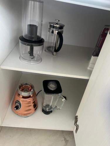 a shelf with a blender and other items on it at Casa d lujo e Xcaret in Playa del Carmen