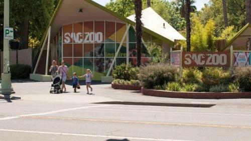 a group of people walking in front of a building at Central 2BR 1BA & Arcade Crib in the heart of Sac in Sacramento