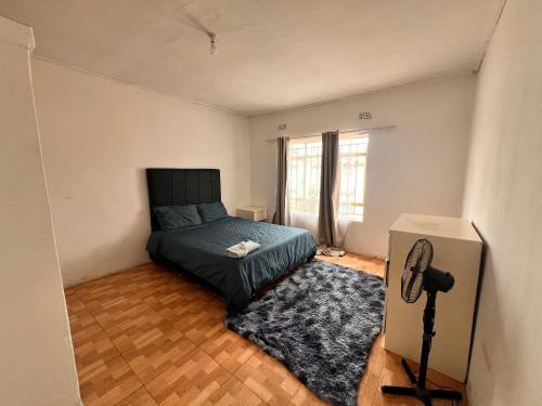 Ένα ή περισσότερα κρεβάτια σε δωμάτιο στο Salama House