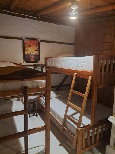 Postel nebo postele na pokoji v ubytování Hotel Gabarra Lodge