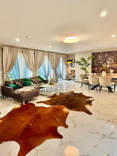 a living room with a couch and a table at Country Haven Comfy & Sleek House in Monasterevin