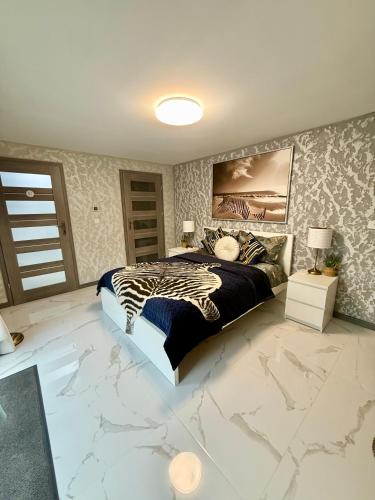a zebra bed in a bedroom with marble floors at Country Haven Comfy & Sleek House in Monasterevin
