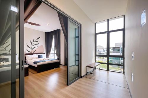 a room with a bedroom and a bed and a mirror at Luxury Villa Kristal Seksyen 7, Shah Alam - Smarthome in Shah Alam