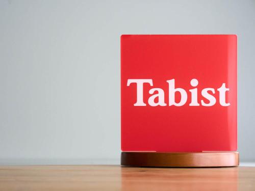 a red book with the word tadaisk on it at Tabist Hotel Aurora Ikebukuro in Tokyo